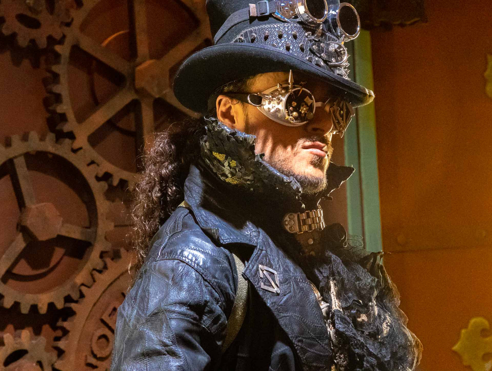 Steampunk costume detail — goggles, bolts, and leather at Photoshop World